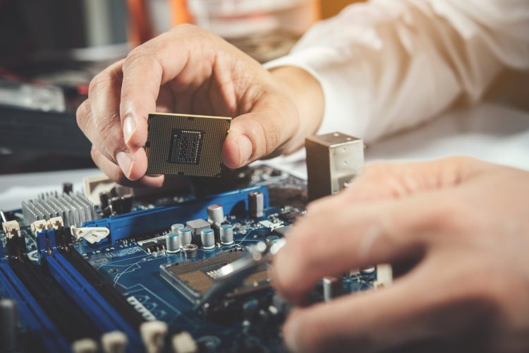 The technician repairing the computer,computer hardware, repairing, upgrade and technology